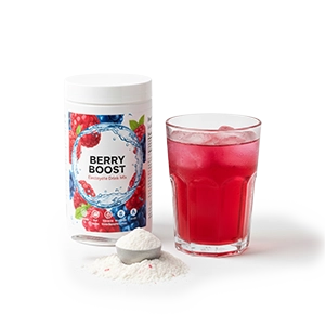 Powered drink mix next to a filled cup